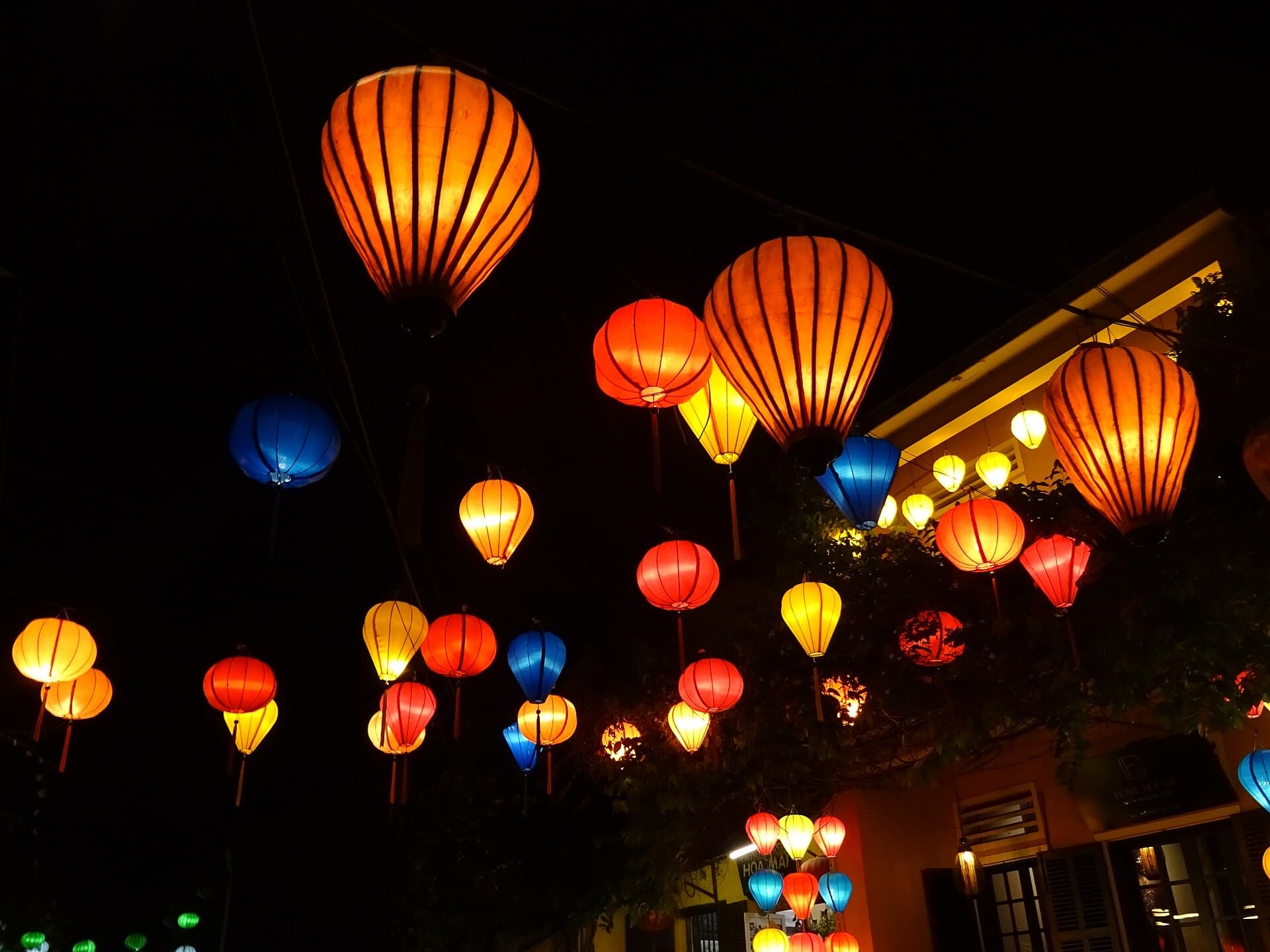 Paper lanterns glowing at night